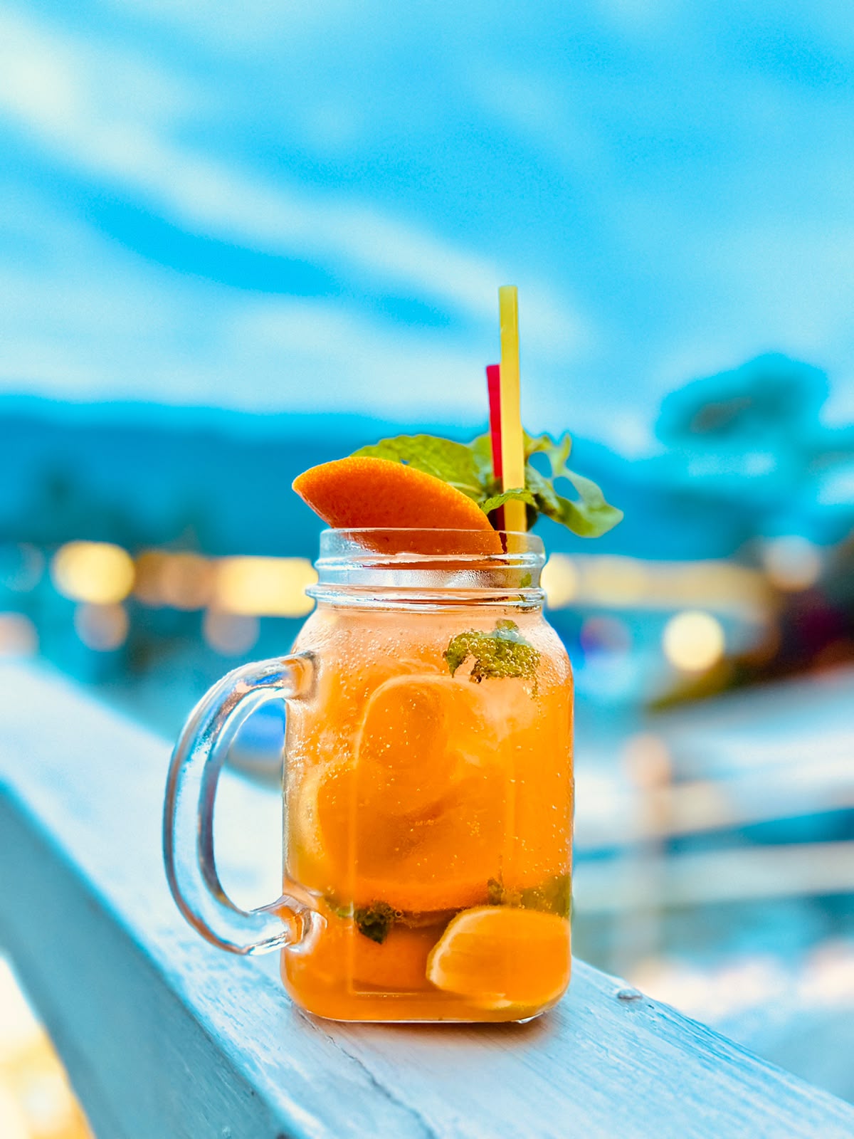 Chilled orange drink with a citrus garnish