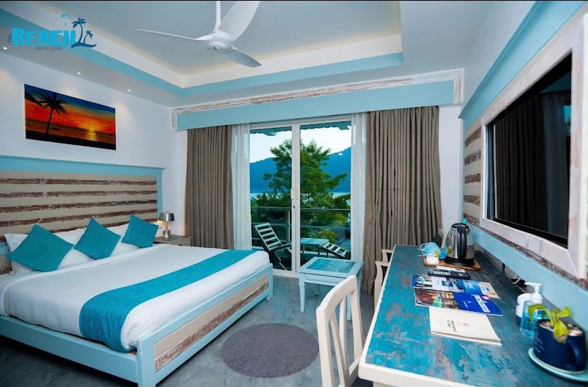 Actual blue and white guest room with a balcony towards the lake